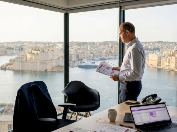 Office manager views budget in Malta office