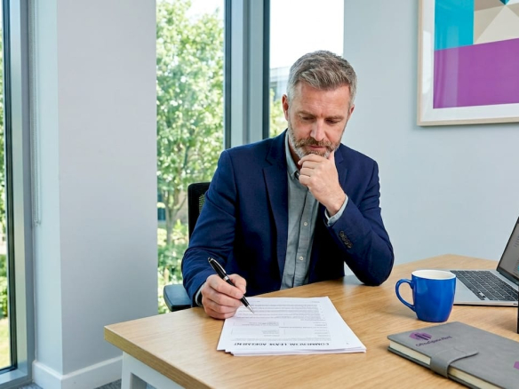 Business owner reviewing lease documents