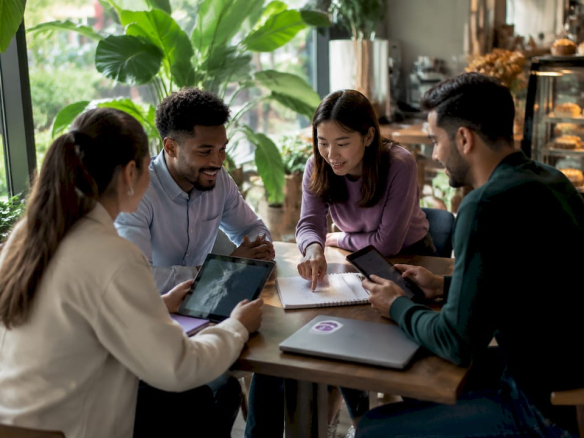 Team collaborating in flexible workspace lounge