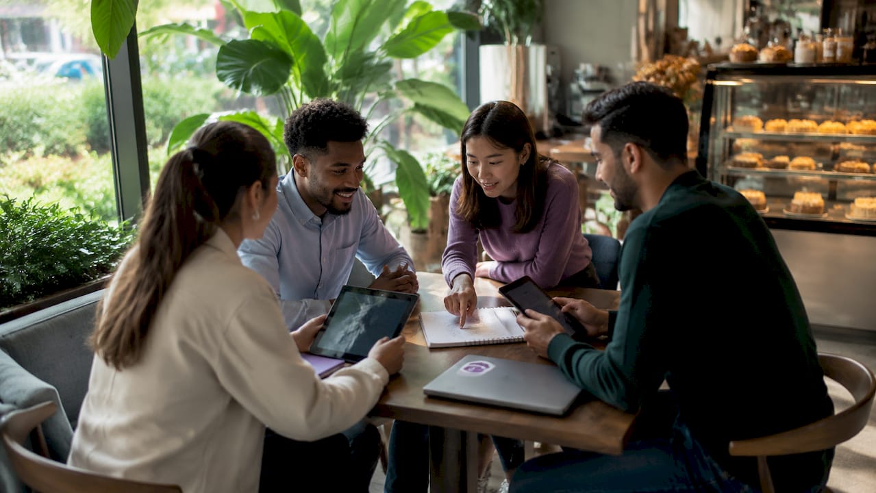 Team collaborating in flexible workspace lounge