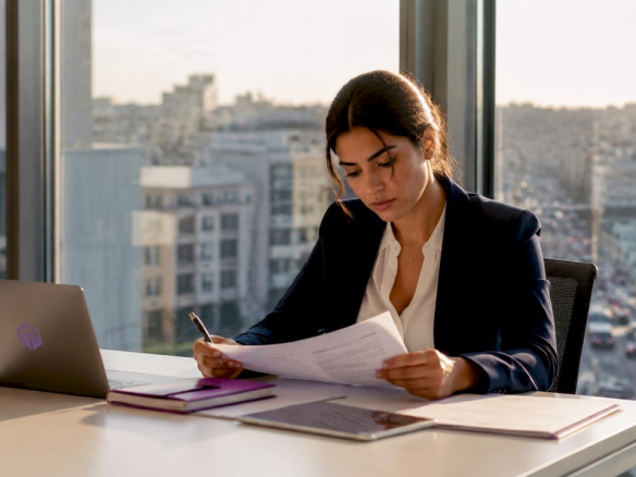Businesswoman reviewing office lease documents office rental pricing factors