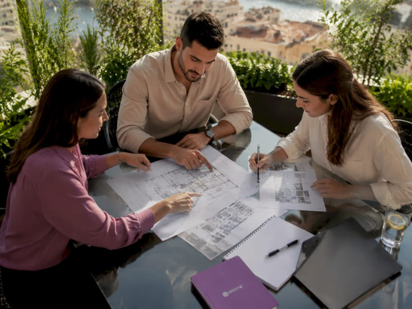 Team planning office layout in Malta coworking space