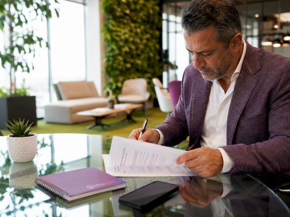 Landlord reviewing lease agreement in office